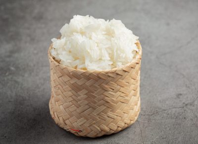 sticky rice in bamboo basket put on dark floor